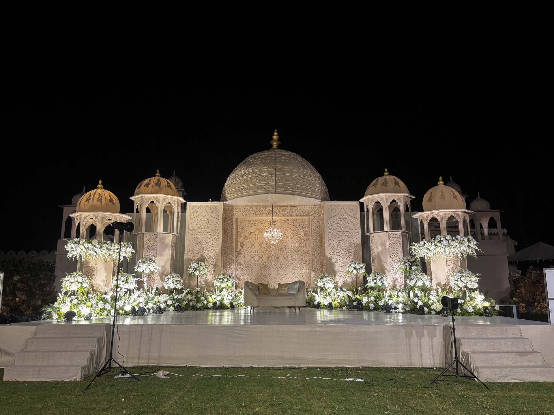 An illuminated palace dome venue set for a Rajasthan destination celebration