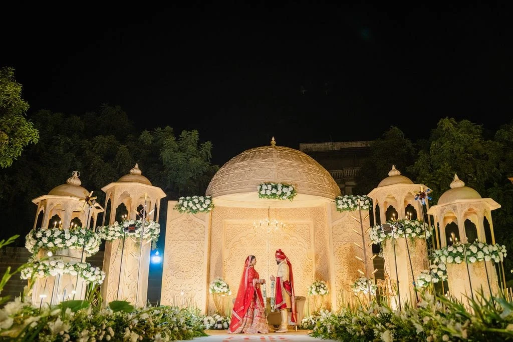 An illuminated palace dome venue set for a Rajasthan destination celebration